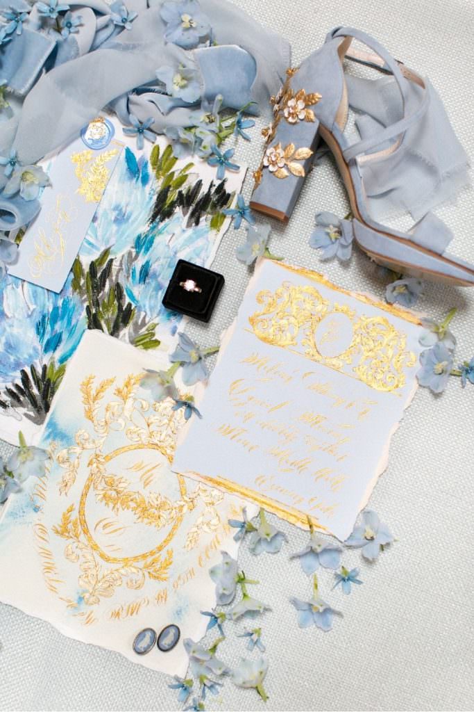 Fine art calligraphy invitations for a summer wedding with elegant decorations.