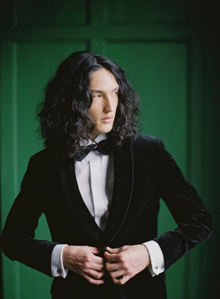 Groom wearing a velvet jacket at Dover Hall for black tie wedding inspiration