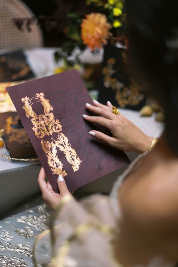 Deep burgundy, copper and gold combine with refined, wild black calligraphy for a fine art, classical wedding invitations suite inspired by renaissance art