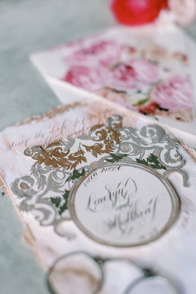 Italian inspired Invitations with an ornate silver and gold crest design