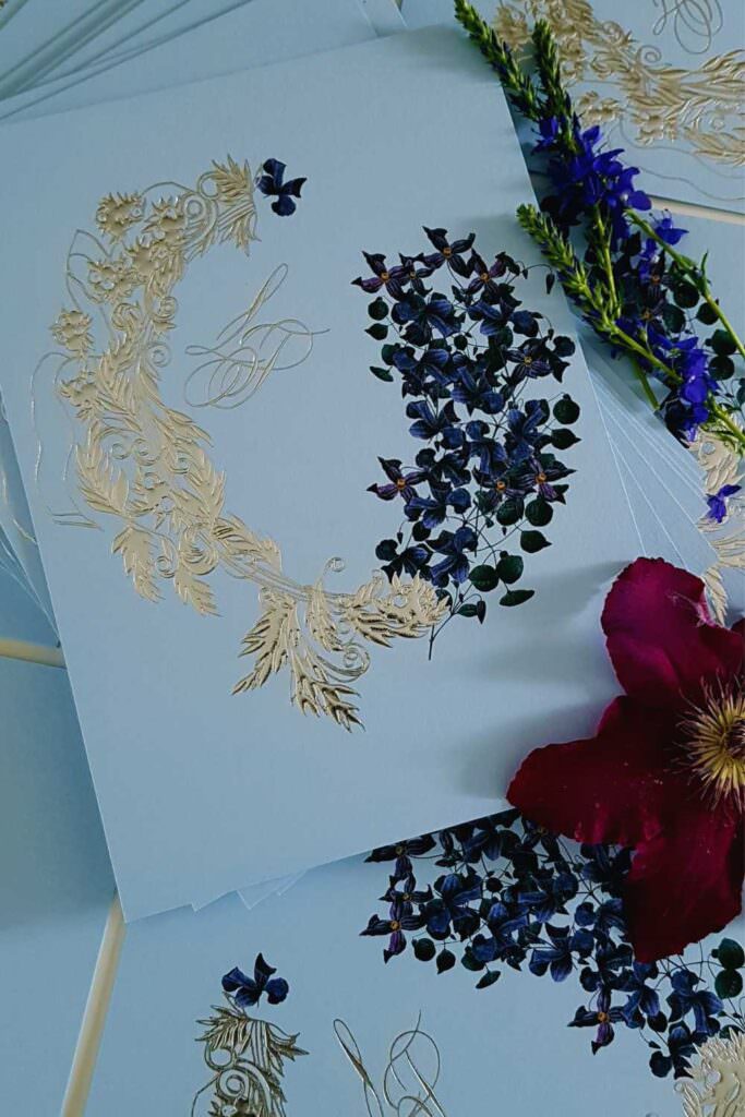 Luxury fine art wedding invitations with silver and blue