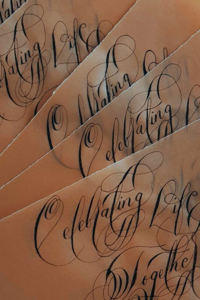 Black tie anniversary invitations with black calligraphy vellum invitation wraps