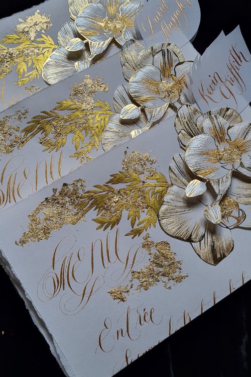 Classical and luxurious, gold calligraphy and white orchid wedding menu design with gold foil leaf and torn textured edges