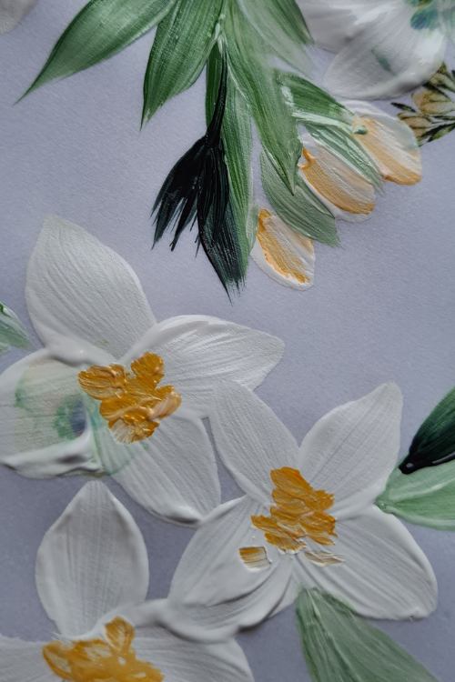 Delicate pale green, dar green foliage with small white flowers upon vellum for a luxury custom envelope