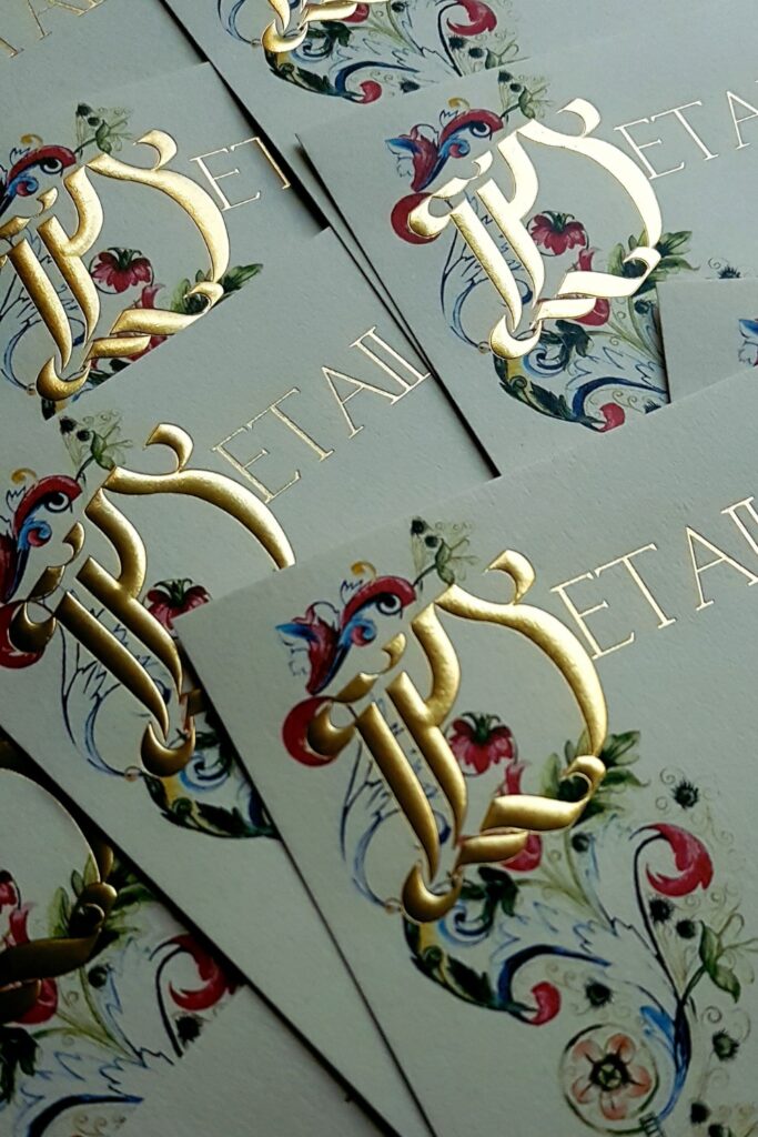 Luxury wedding Invitation design with cream and gold embossed printed letter design paired with Florence inspired watercolour