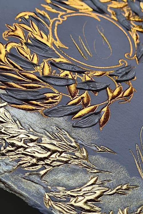 Romantic Amalfi Style Invitations close up detail on gold embossed crest