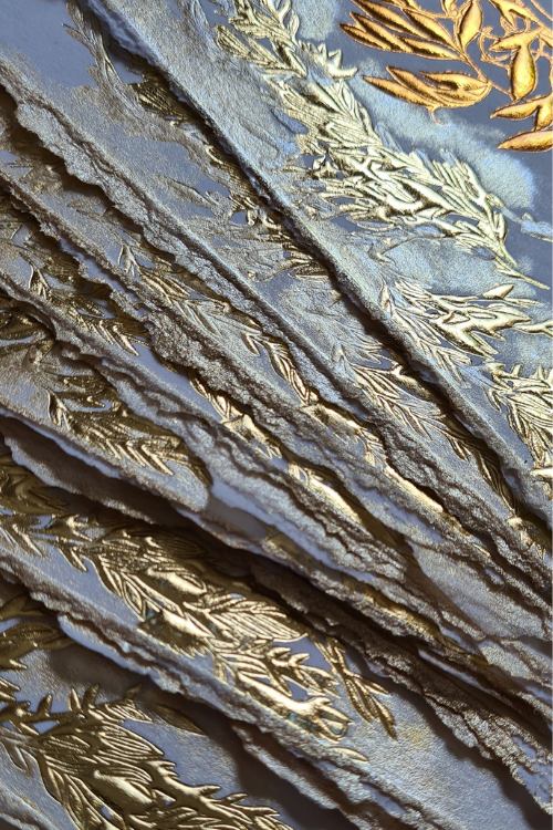 Romantic Amalfi Style Invitations with pale gold and copper embossed leaves design paired with torn edges